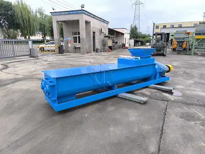 Double shaft mixer for uniform mixing of fertilizer raw materials